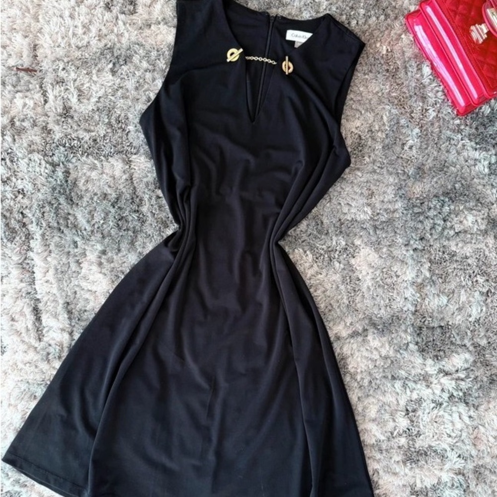 H&M Elegant Black Mini Dress with Gold Accents